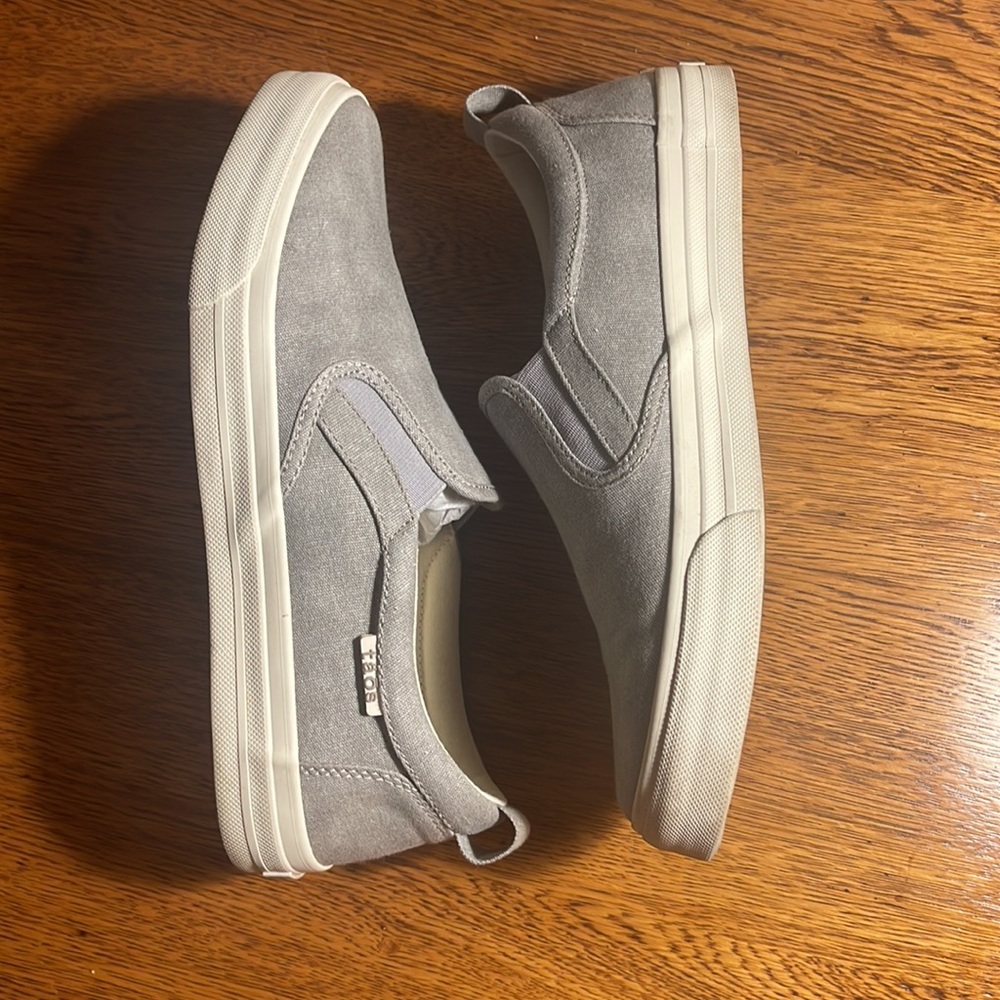Taos gray slip on sneaker. New with original box. Size 9.5
